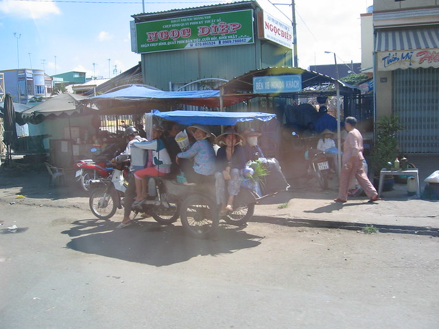 At least 10, maybe more, on a taxi scooter